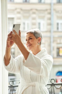 Man photographing with mobile phone