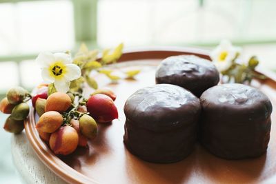 Close-up of fruits in plate on table