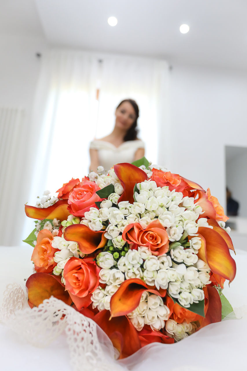 PORTRAIT OF WOMAN WITH PINK FLOWER BOUQUET IN POT