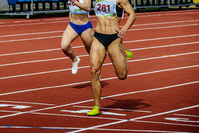 Low section of woman exercising on court