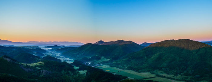Scenic view of mountains against sky during sunrise