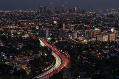 High angle view of illuminated cityscape at night