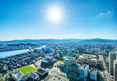 High angle view of buildings in city against sky