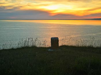 Scenic view of sea against sky during sunset