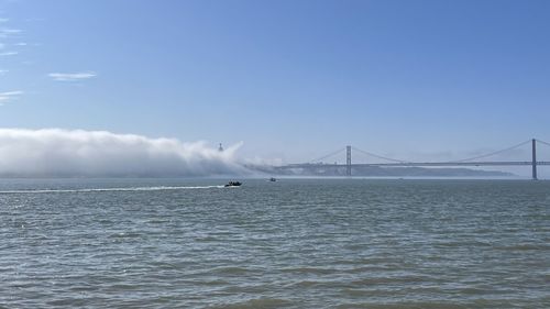 View of suspension bridge over sea