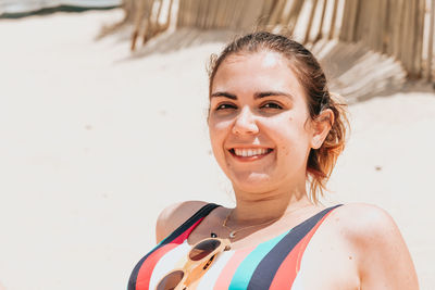 Portrait of young woman swimming in sea