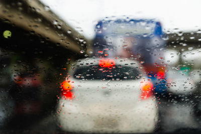 Close-up of wet glass window in rainy season