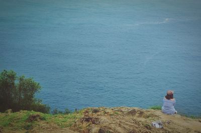 Rear view of woman looking at sea