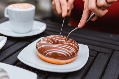 Midsection of coffee cup on table