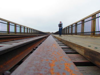 Railroad station platform against clear sky