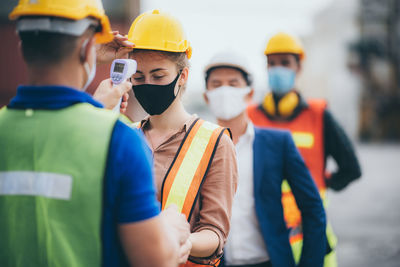 Group of people working at construction site