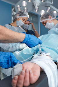 Midsection of man wearing mask