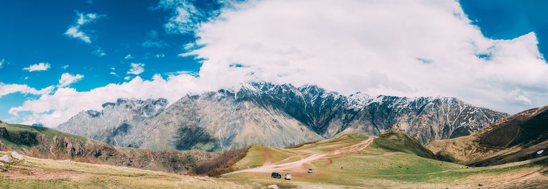 Scenic view of snowcapped mountains against sky