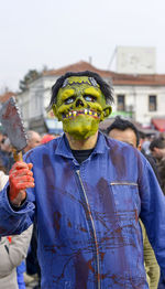 Close-up of man wearing mask at carnival