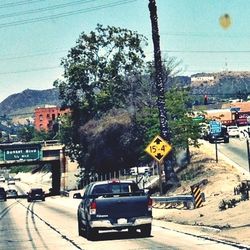 Cars on road against sky