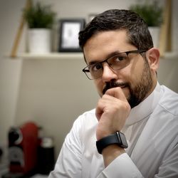 Portrait of man sitting at office