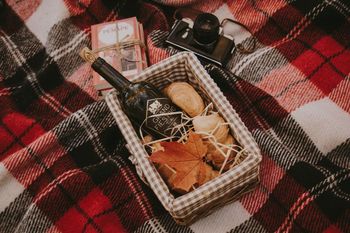 High angle view of wine bottle and camera