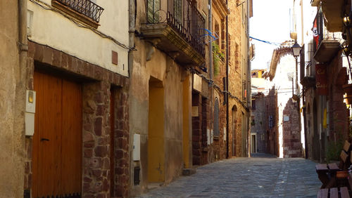 Narrow alley amidst buildings in city