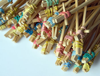 High angle view of multi colored toys over white background