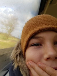 Close-up portrait of girl in car