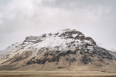 Scenic view of snowcapped mountain against sky