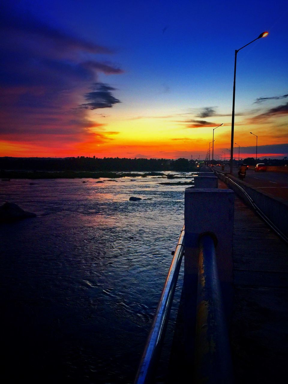 sunset, water, sky, sea, orange color, transportation, scenics, cloud - sky, beauty in nature, dusk, nature, tranquil scene, tranquility, the way forward, cloud, dramatic sky, outdoors, silhouette, idyllic, diminishing perspective