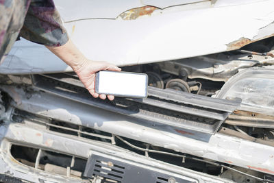 High angle view of man working on car