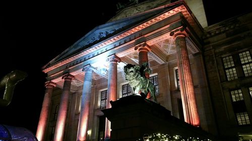Low angle view of illuminated building at night
