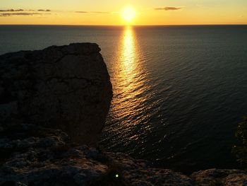 Scenic view of sea at sunset