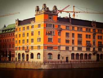 Low angle view of buildings at waterfront