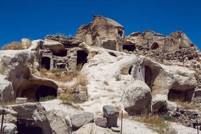 Old town of uchisar in turkey houses and the fortress in the summer in sunny weather