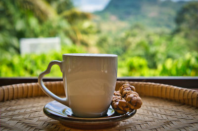Close-up of coffee cup on table