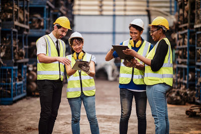 People working with arms raised