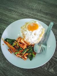 High angle view of breakfast served in plate on table