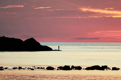 Scenic view of sea against sky at sunset