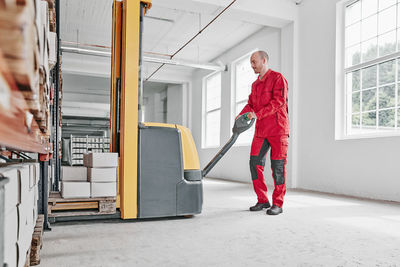 Man in factory using forklift