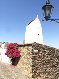 Low angle view of building against clear blue sky