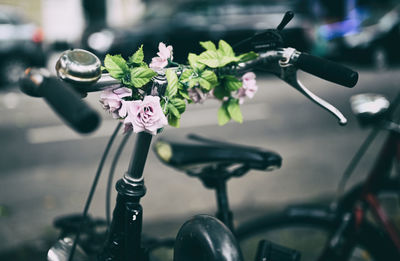 Cropped hand of woman with bicycle