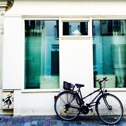 Bicycle parked in front of building