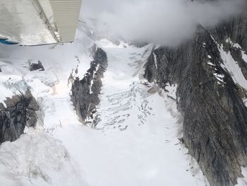 Scenic view of snow covered mountains