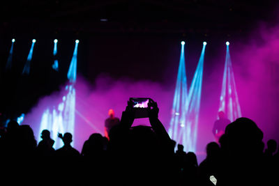 Silhouette people at music concert