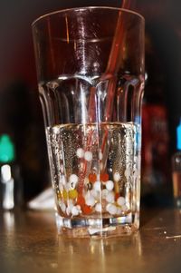 Close-up of beer glass on table