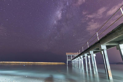 Scenic view of sea against sky at night