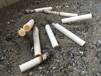 High angle view of cigarette smoking on table