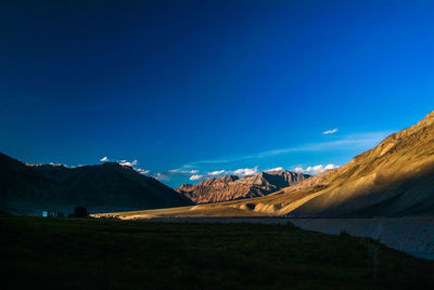 Scenic view of landscape against sky at night