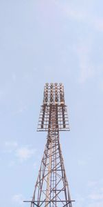 Low angle view of communications tower against sky