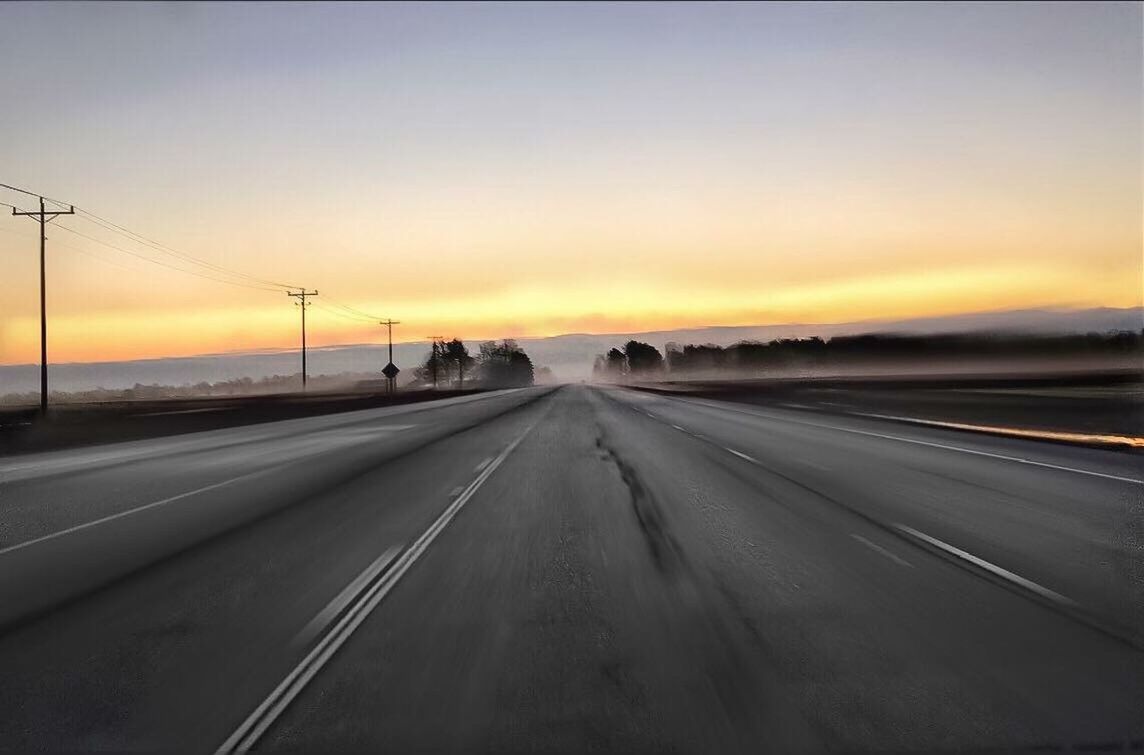 VIEW OF ROAD AT SUNSET