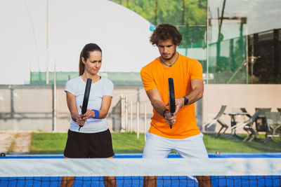 Tennis players playing at court