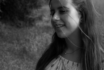 Close-up of young woman at park