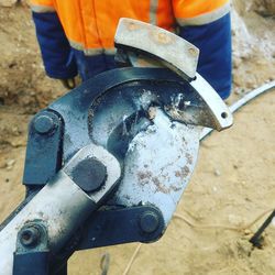 High angle view of person working on metal